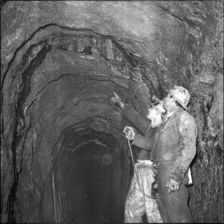 Geologists analysing shaft, Oil deposit; 1964.