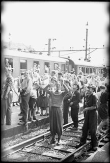 After World War 2: Swiss people cheering at POWs - presumably Italians - going home, 1946.