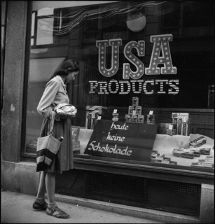 Woman looking at goods on display, around 1944.