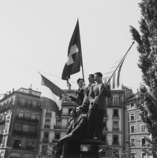 Young men celebrating the end of second world war; 1945 .