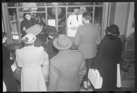 People queue at post office counter, 1940