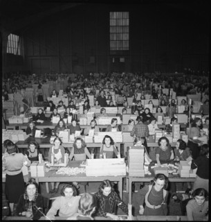 Women preparing parcels, christmas present for soldiers. 1940