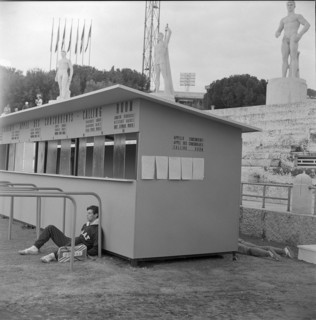 Rome 1960: greek athlete leaning against calling room.