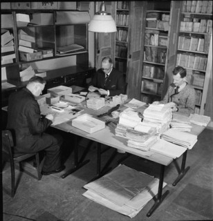 Public administration of food ration cards, coupons, around 1945.