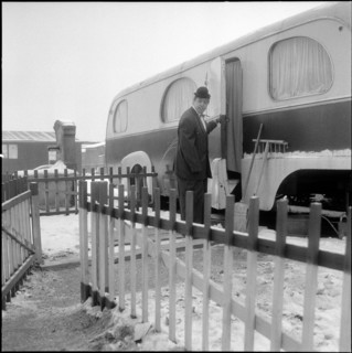 Jacques Romeo Andreff in front of his caravan, trailer.