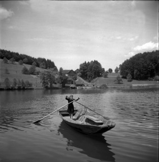 Girl standing in a rowing boat on Lake Rotsee 1947