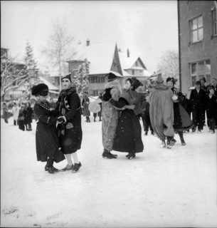 Dancing in the snow on carnival festivities circa in 1950