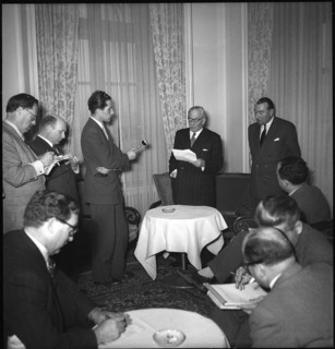 Professor Pirenne (l) reads statetment from Leopold of Belgium, Geneva 1950