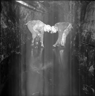 Geologists analysing shaft, Oil deposit. 1964