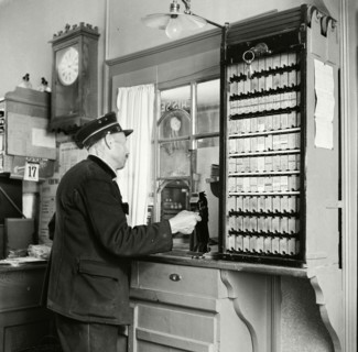 Oldest railway employee at the client counter, 1946.