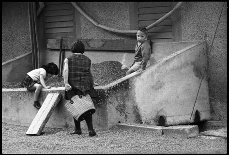 Children playing in a sandpit, 1968.