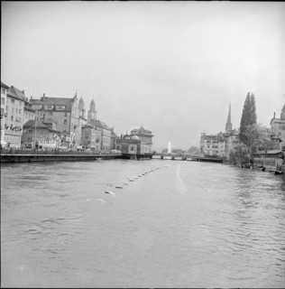 Zurich Festival 1953; fountain in the distance, Limmat river.