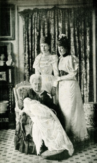 This images shows Her majesty Queen Victoria with the Baby Prince and the Princess Alexandra of
