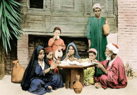 This 1903 illustration shows an arab family at dinner.