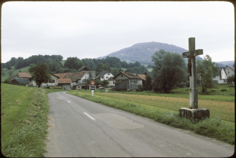 Cross on the roadside in Vellerat, 1980.