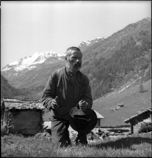 Farmer praying in the Turtmanntal valley, Switzerland, 1940