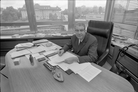 SDA managing director Georges Duplain in his office, 1971
