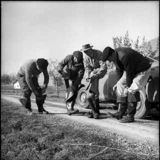 Electric fishing in Valais, rubber boots for isolation, 1956