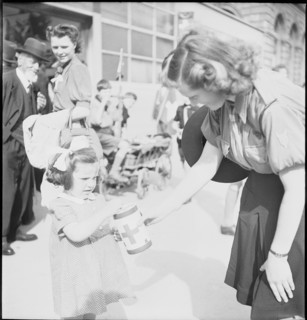 May 8th. 1945, Armistice's day: Woman collects money for the Swiss donation