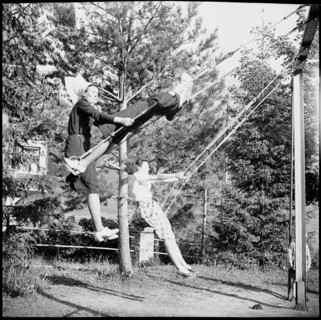 Young nurses swinging in the garden
