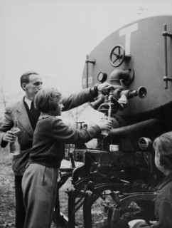 Refugees from Hungary drinking water out of tanker 1956