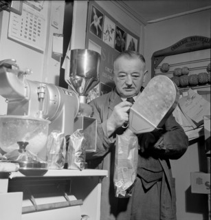 Coffee is filled into bags on Don Robin day in La Tour de Peilz, 1954