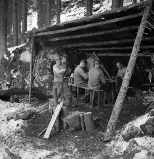 Woodcutter having a break in a refuge, 1943