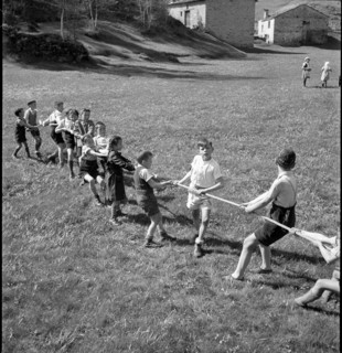 Children playing tug of war, 1942