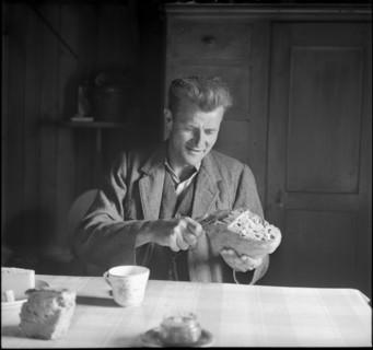 Farmer cutting bread, 1941