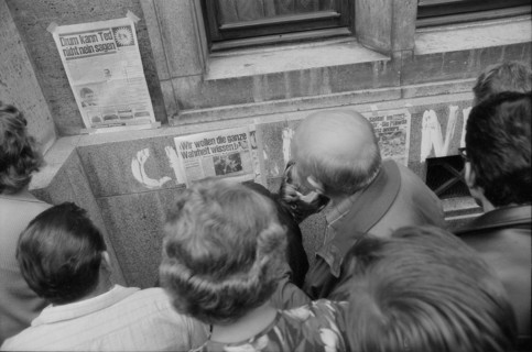 Prague 1968 after the invasion of the Warsaw Pact troops: Man filling up his car in front of the