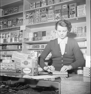 Davos, saleswoman in a tobacco shop; 1949