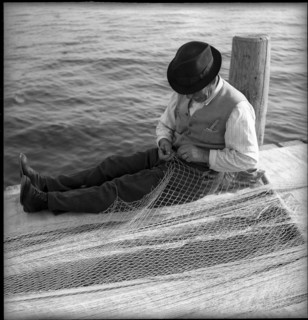 Fishermen mending nets on Lake Geneva, Ouchy 1945