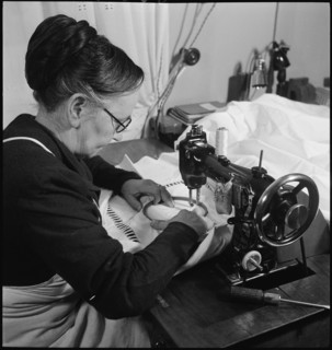 Home embroideress at work, 1942.