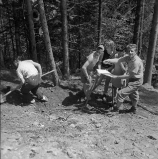 Isenfluh, volunteers building access road to mountain village; 1959.