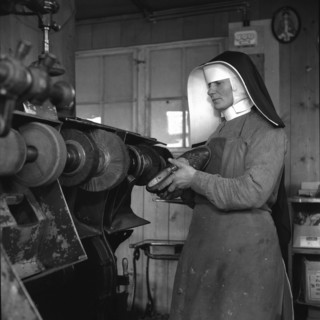 Sister Hugo, Switzerland's  first shoemaker at work; 1944.