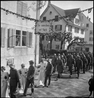 Soldiers' wedding; three wedding couples passing through village; 1941.