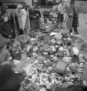 Collect of non-ferrous metal; pile of metal articles; 1942.