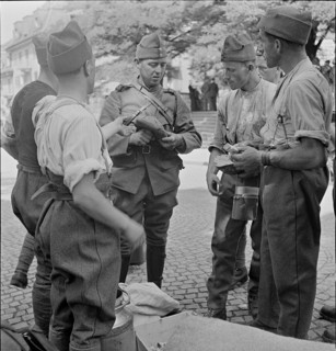 Soldiers receiving food; 1939.