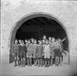 Children posing for photographer; 1941.