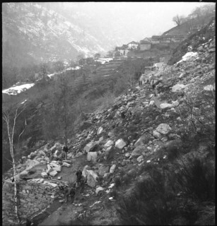 Landslide in Maggia valley; rubble blocking street; 1950.
