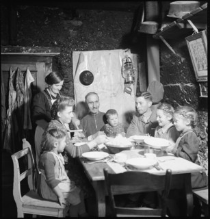 Family eating together, 1946.