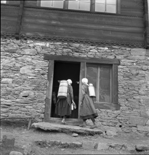 Lötschental, women carrying milk churn, 1941.