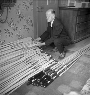 Man with hail defense rockets, 1951.