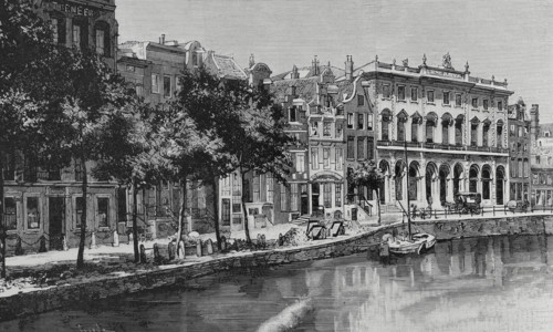 Amsterdam, Netherlands. Nieuwezijds Voorburgwal street and canal with the Royal Post Office on the