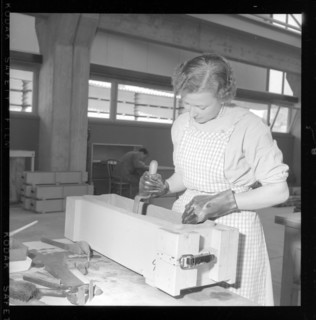 worker fills asbestos cement in a window box form.