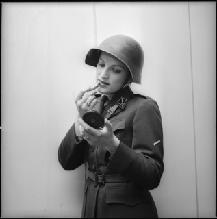Woman soldier putting lipstick on, Zurich 1973.