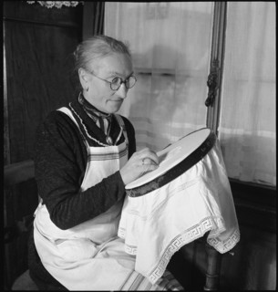 Home embroideress at work, 1942.