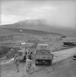 Workers preparing the ground for a drilling derrick; 1958.