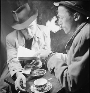 Black marketeering, marketeer dealing with food ration cards; 1942.