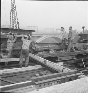 Construction worker demolishing a railway bridge 1941.